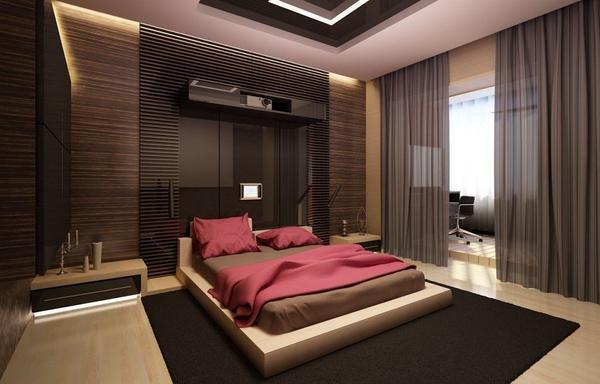 Атрибутами современной спальни являются неоновая подсветка возле тумбочек и встроенные в стену электронные гаджеты 