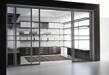 Contemporary-closet-with-carpet-and-glass-sliding-doors