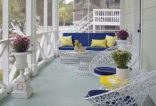 dewey-furniture-for-a-beach-style-porch-with-a-savannah-and-porch-by-rethink-design-studio