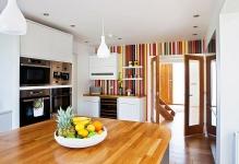 Creative-and-colorful-striped-accent-wall-for-a-crisp-modern-kitchen